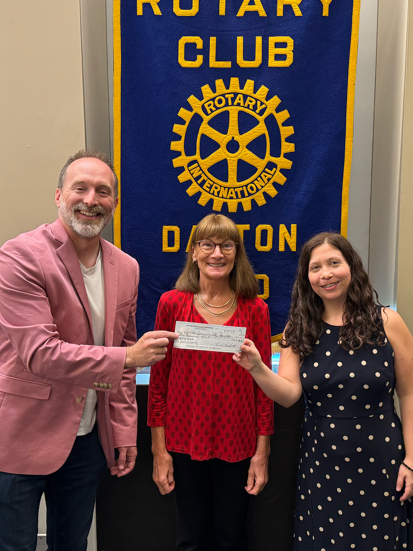 Matt Jessup presents an Impact Grant on behalf of the Rotary Club of Dayton Foundation to Sinclair Community College for their student food pantry.