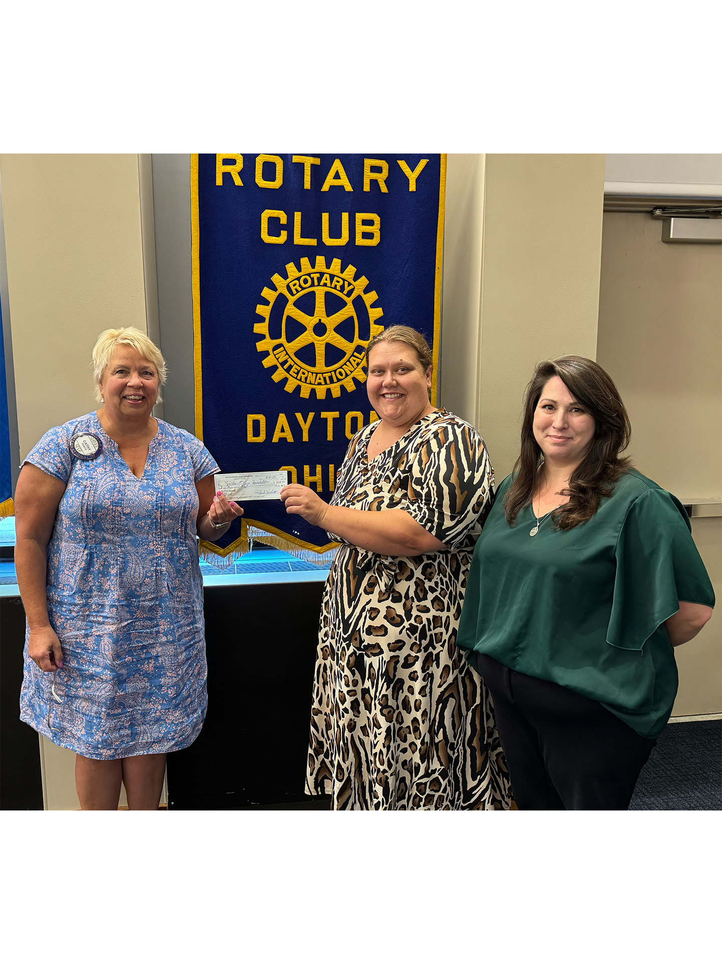 Rotary Club of Dayton Foundation President Cathy Ponitz presents an Impact Grant to the Montgomery County Mentoring Collaborative.