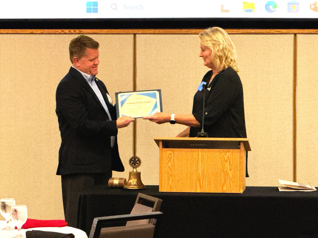 Past District Governor Dottie Meade presented the Club Excellence Award to iPast President Randy Domigan, recognizing our club's achievement of District benchmarks and goals.