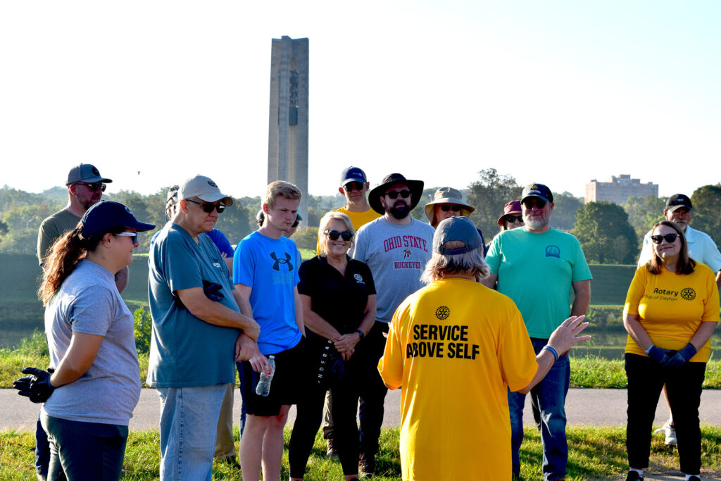 Organizer and Rotarian Sarah Hippensteel Hall shares Miami River facts and safety tips before dispatching 30 volunteers.