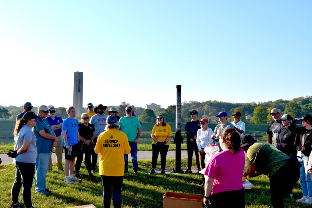 Organizer and Rotarian Sarah Hippensteel Hall shares Miami River facts and safety tips before dispatching 30 volunteers.