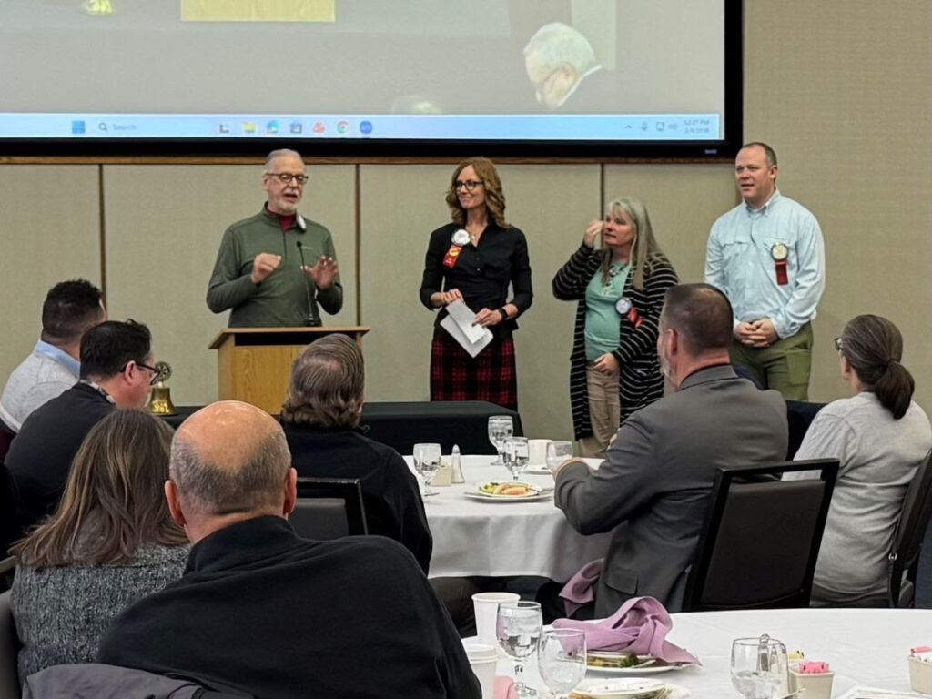 Trustee John Lyman presents an Impact Grant to Eastway Behavioral Healthcare on behalf of the Rotary Club of Dayton Foundation.