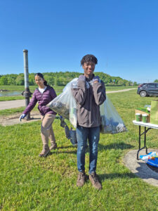 A young man helping remove garbage along the banks of the Great Miami River in Dayton, Ohio.