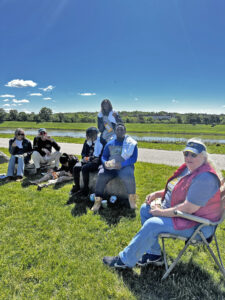 Rotary volunteers enjoy a lunch break along the Great Miami River.