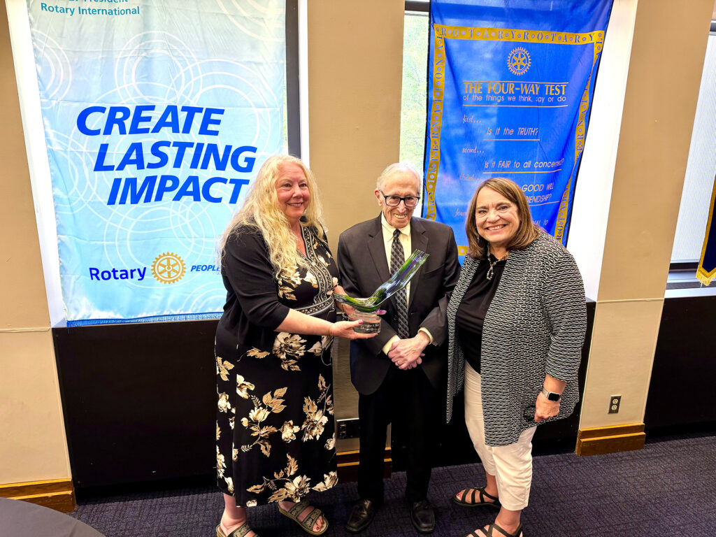 President Kelly Lehman and Peace Committee Chair Carolyn Rice present the 2026 Irv Beiser Peace Award to Judge Walter H. Rice.
