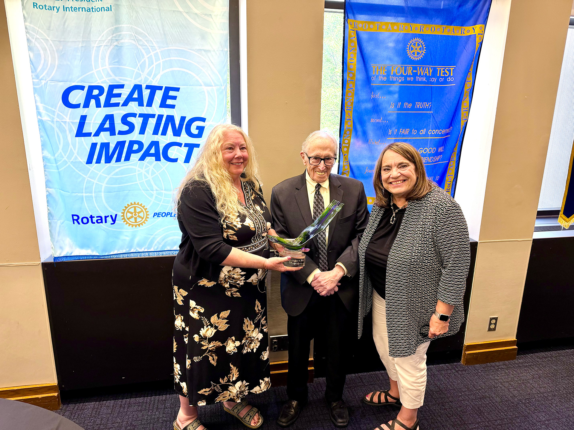 President Kelly Lehman and Peace Committee Chair Carolyn Rice present the 2026 Irv Beiser Peace Award to Judge Walter H. Rice.
